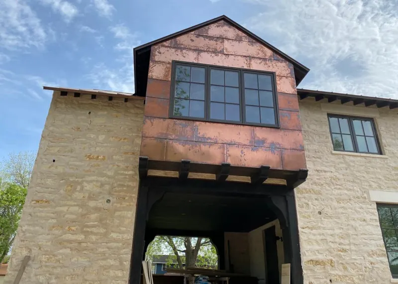 Copper metal panel facade on a stone building for Metal Roof Coating in Casas Adobes